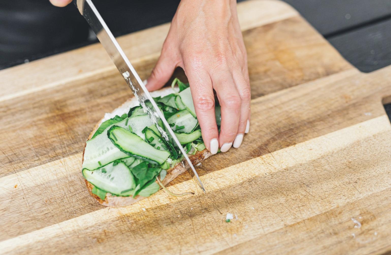Fresh ingredients arranged on a kitchen bench for a live cooking session